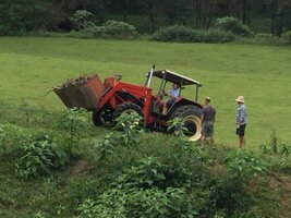 Zetor tractor on slope with Tim & Jarrah helping clean hillside of sticks 24th Apr 2017 pic2.jpg